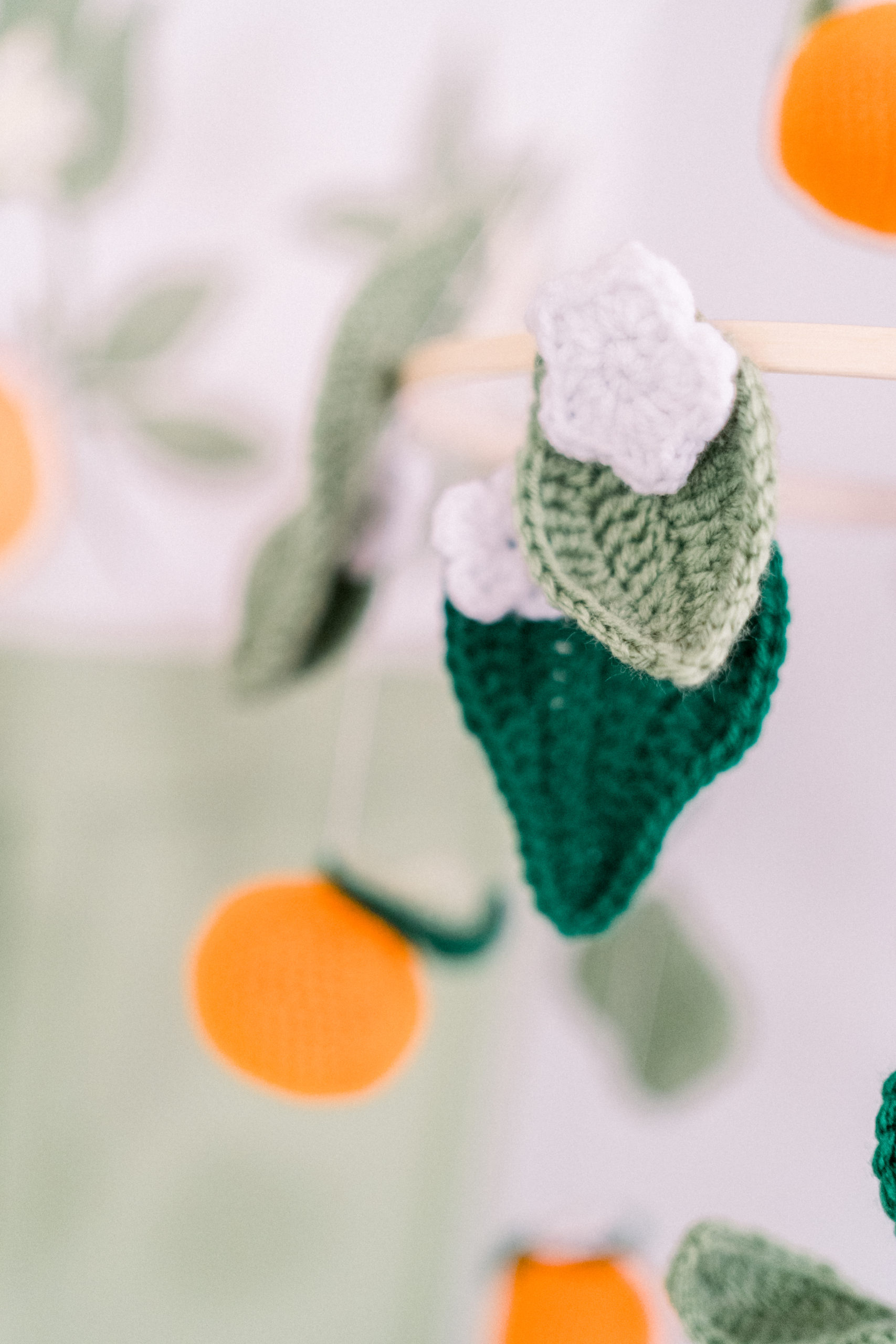 knit orange nursery mobile