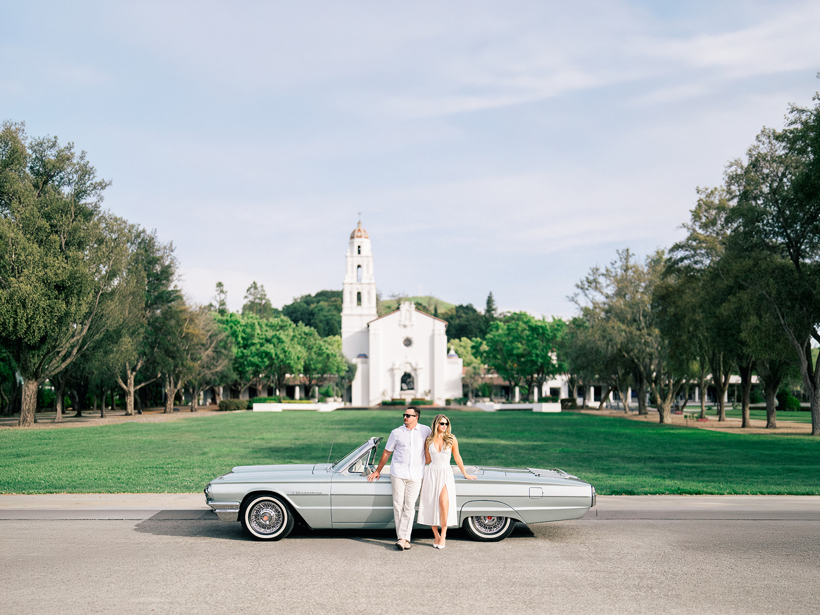 Classic Thunderbird parked outside a chapel at Saint Mary's College during Julia and Derek's Bay Area engagement session